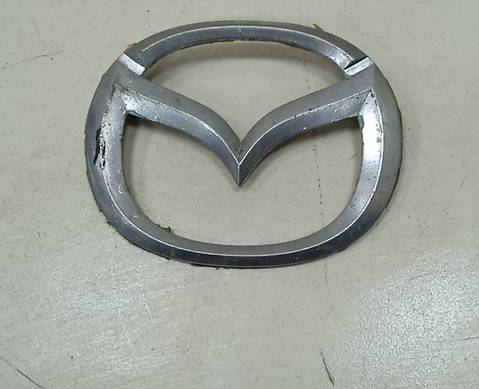 Эмблема решетки радиатора для Mazda 323 VI (с 1998 по 2004)