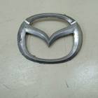 Эмблема решетки радиатора для Mazda 323 VI (с 1998 по 2004)