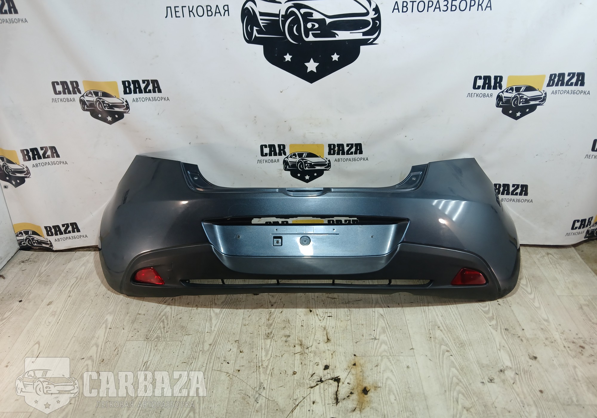 D65150221 Бампер задний (в сборе) для Mazda 2 II (с 2007 по 2014)