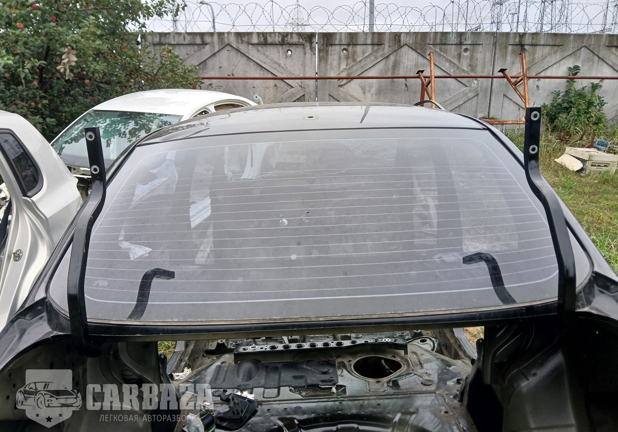 79700EL100 Стекло заднее (седан) С11 для Nissan Tiida I (с 2004 по 2014)