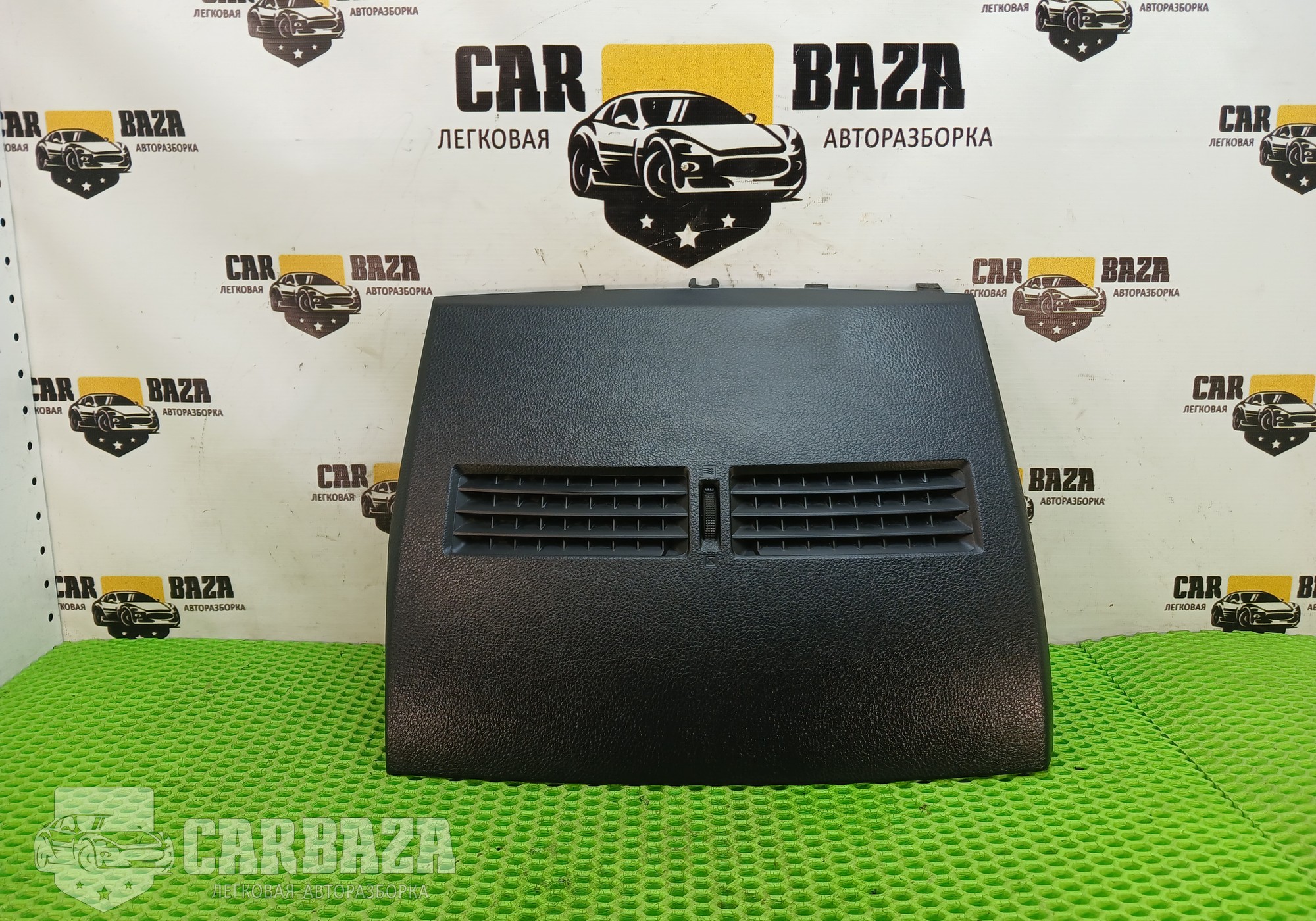 68414EM01A Накладка торпедо центральная C11 для Nissan Tiida I (с 2004 по 2014)