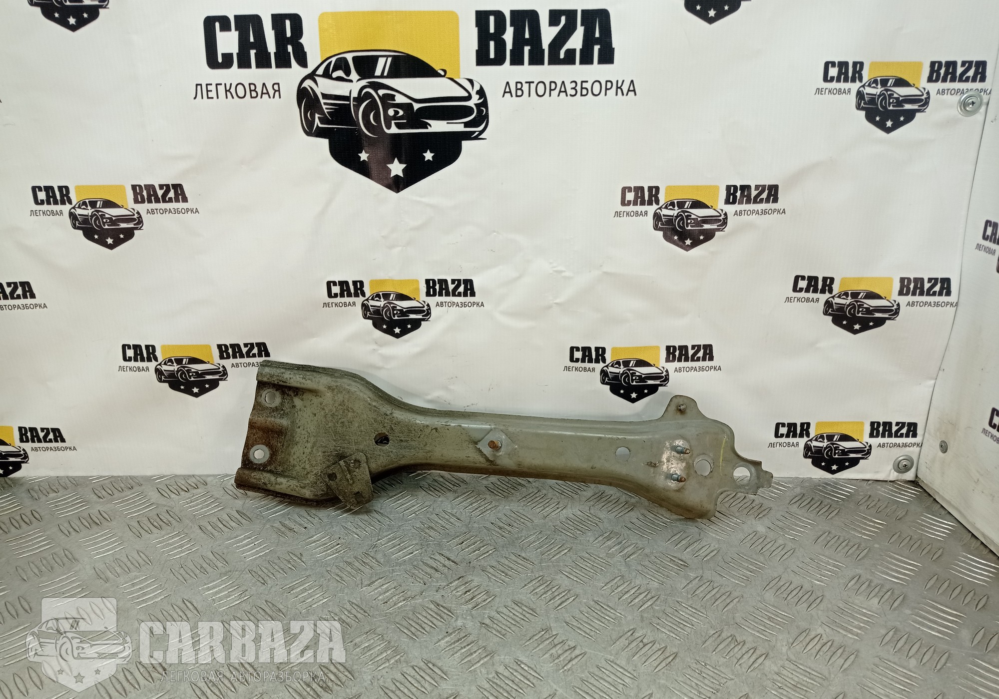 62550EL030 Кронштейн замка капота С11 для Nissan Tiida I (с 2004 по 2014)