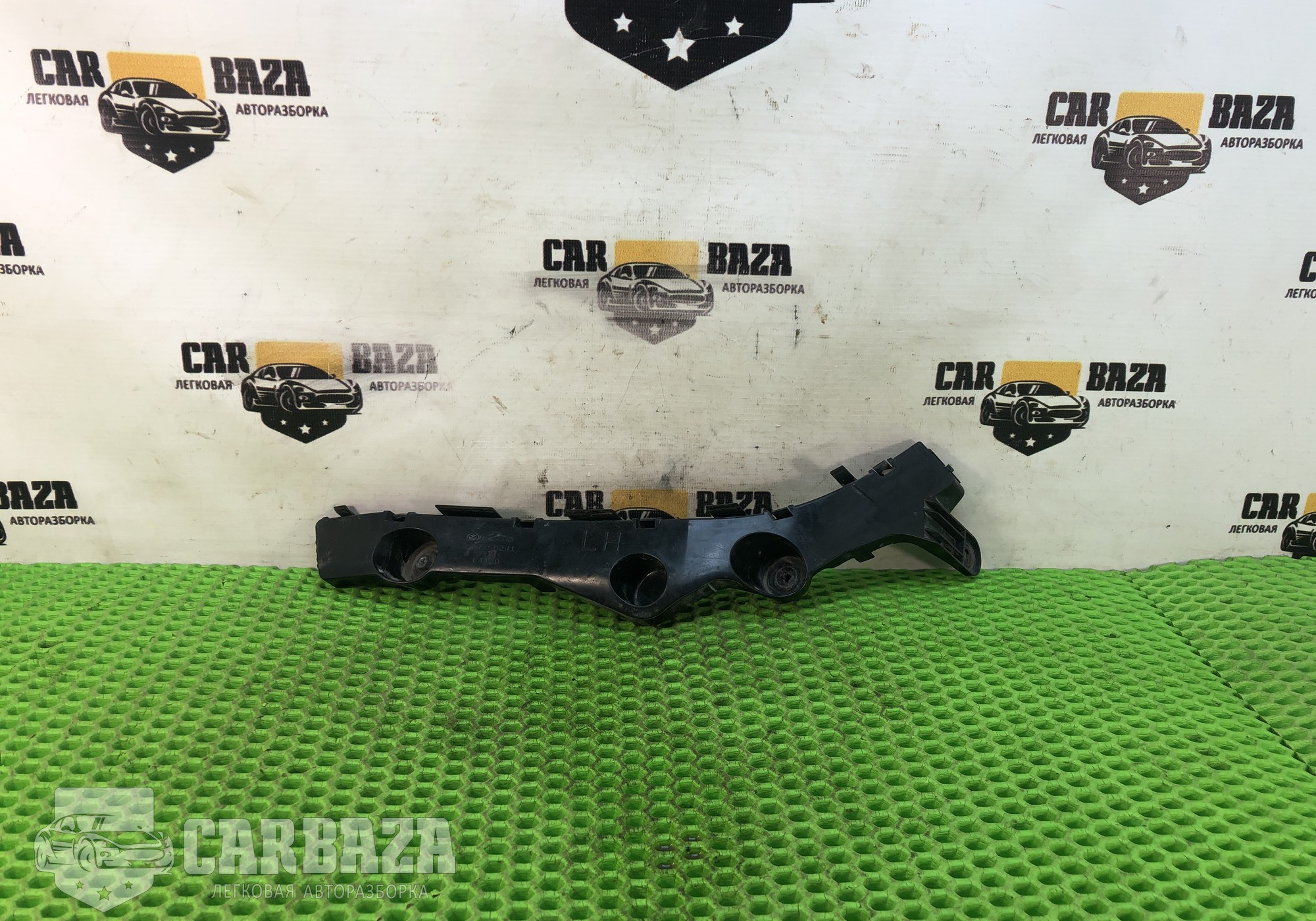 DF71502J1 Кронштейн заднего бампера левый для Mazda 2 II (с 2007 по 2014)