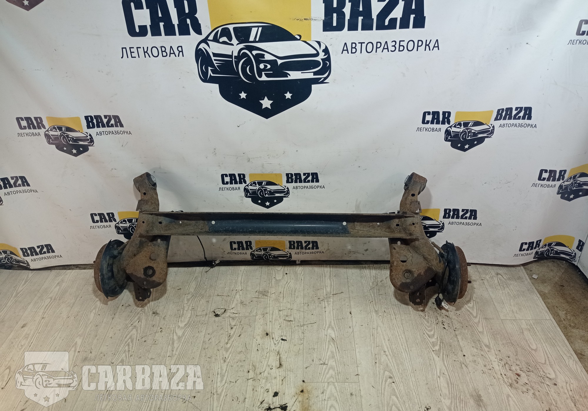 DR6128B00A Балка задняя для Mazda 2 II (с 2007 по 2014)