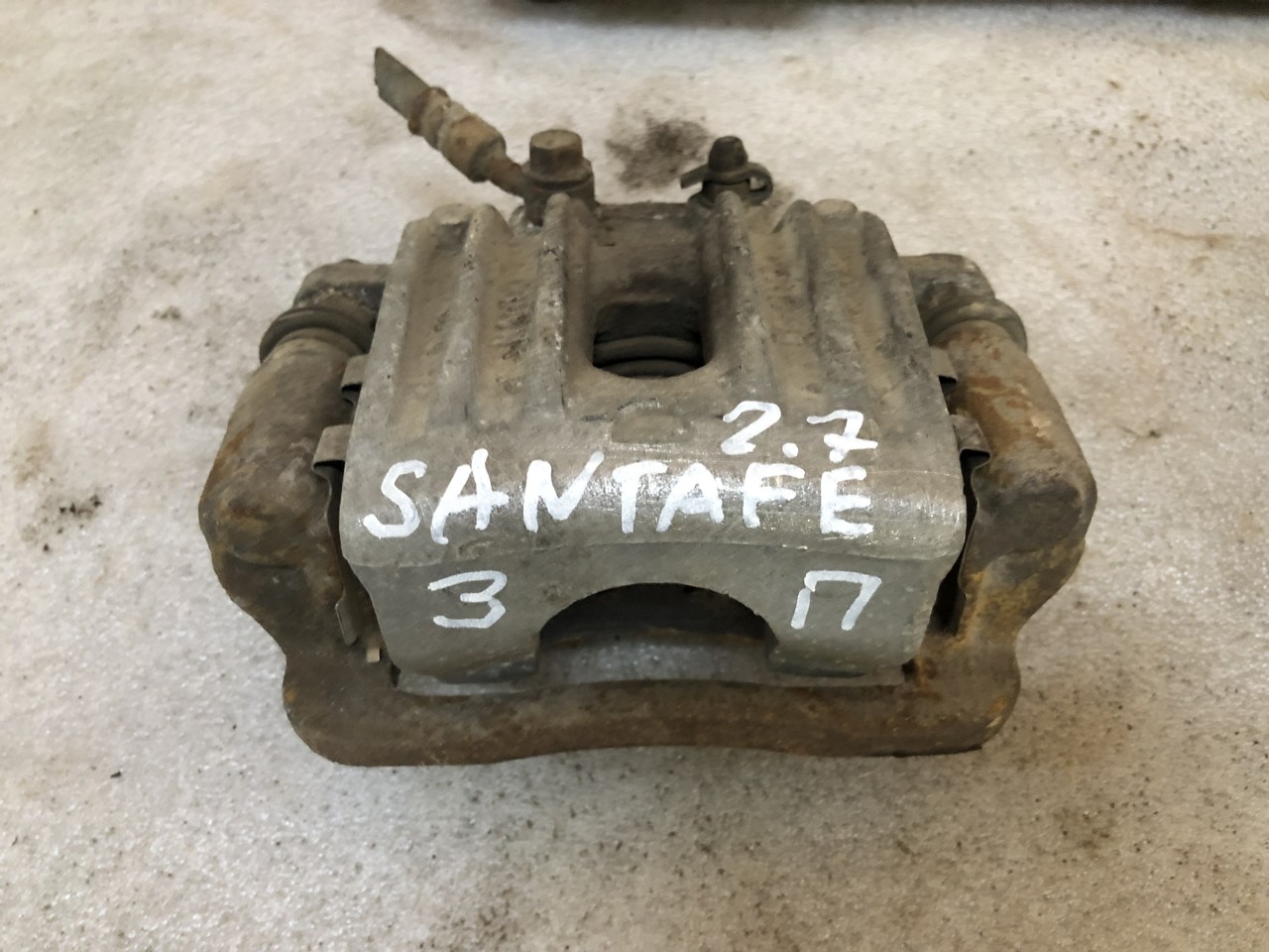 Суппорт задний правый Hyundai Santa Fe II